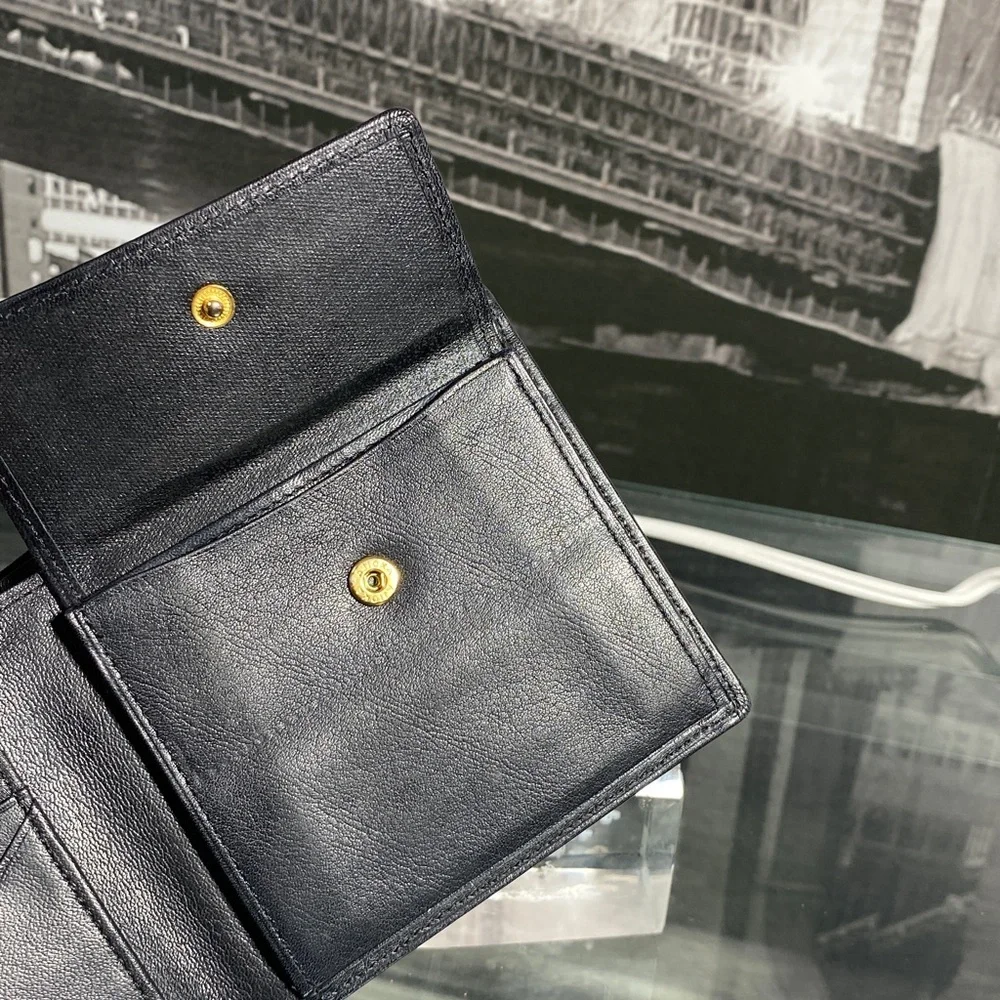 Authentic YSL Sleek black leather bifold wallet